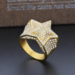 Macro shot of luxury gold-plated star ring with pavé-set white zircon detailing
