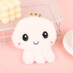 Macro detail of cute white plush octopus keychain with soft fur and embroidered face