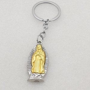 Detailed close-up of Virgin of Guadalupe metal keychain in silver and gold dual-tone