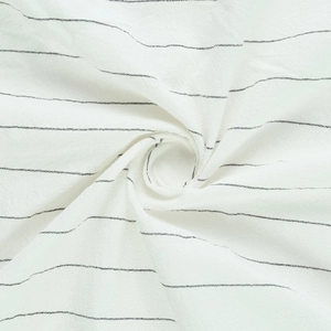 Macro shot of vertical striped linen fabric showing soft texture and natural fiber weave