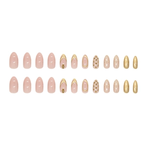 Champagne glitter almond press-on nails with gold French lines and metallic studs