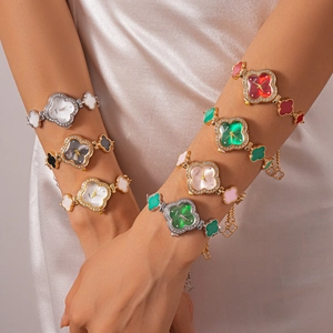 Elegant clover flower bracelet watch with rhinestone bezel and adjustable pull chain