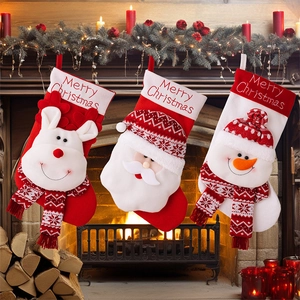 Three festive Christmas stockings with reindeer, Santa, and snowman on a mantelpiece