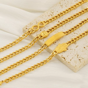 Chic gold-plated stainless steel Cuban link bracelets with various pendants on white silk
