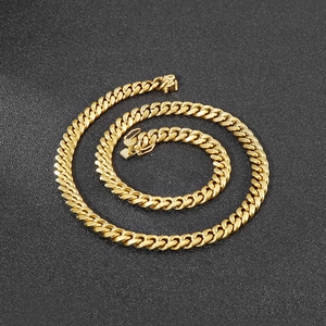 Detailed close-up of an 8mm gold titanium steel Cuban chain with a secure lobster clasp