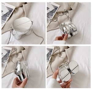 Artistic silver mirror body-shaped crossbody bag with chunky wavy metal chain detail