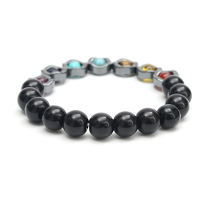Close-up of yoga beads bracelet with hematite, colorful stones, and metal spacers