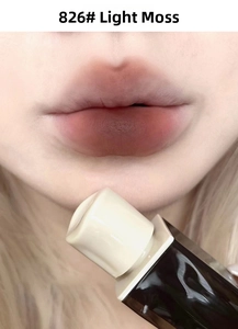 Detailed swatch of matte amber velvet lip glaze shade 826 on a model's lips