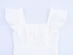 Detail of square neckline with ruffled flutter sleeves and 3D floral pearl embroidery
