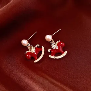 Vintage red rocking horse earrings with pearl accents and gold plating for women