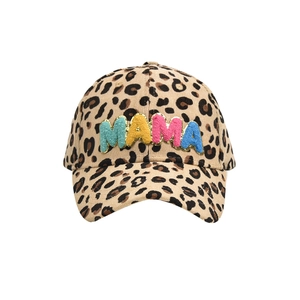 Detail of leopard print corduroy hat with colorful MAMA chenille patches and gold glitter edges