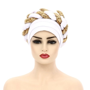 Detail of white turban hat featuring gold sequins and a stylish braided design for women
