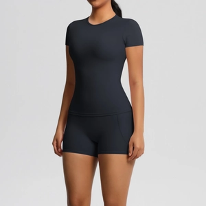 Close-up of tight-fitting moisture-wicking charcoal grey yoga set with shorts