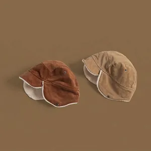 Vintage corduroy trapper hat with warm faux shearling lining in brown and khaki colors