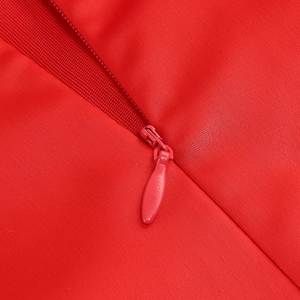 Detail view of the hidden back zipper and red fabric texture on a sexy bodycon dress