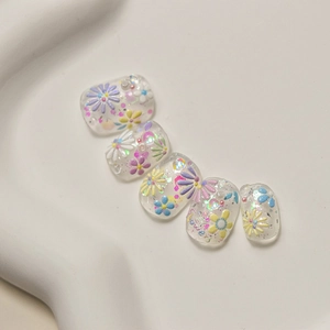 Detail of jelly nail stickers featuring colorful daisy patterns and flower text
