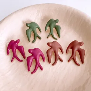 Minimalist enamel swallow bird stud earrings in three colors with gold plated metal edges