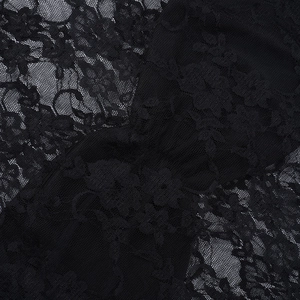 Detailed macro view showing the intricate black lace floral pattern and mesh texture