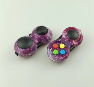 Macro detail of starry purple stress relief pads with silicone buttons and joysticks