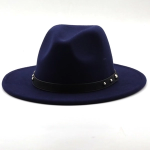 Detailed view of dark blue fedora hat featuring black leather belt with silver rivets