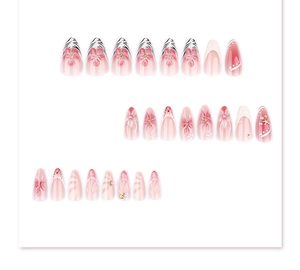 Detail of pink and white press-on nails with 3D floral accents and zebra patterns
