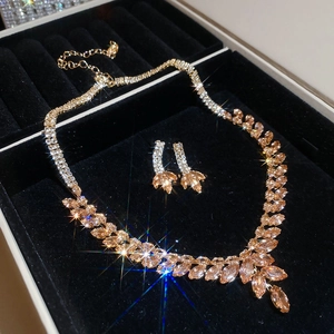 Detailed close-up of zircon wheat tassel jewelry set featuring champagne rhinestones
