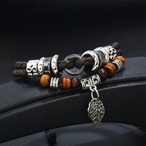 Retro multi-layer braided leather bracelet with wooden beads and silver leaf pendant