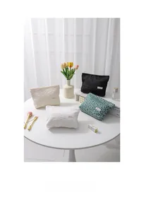 Detailed set of canvas cosmetic bags in assorted bubble textures and floral patterns