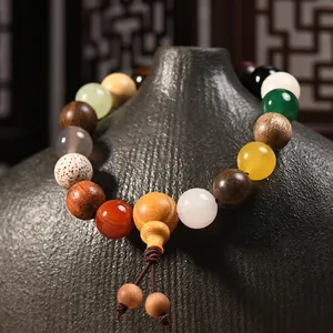 Traditional Chinese 18 seeds Buddhist prayer beads bracelet on dark ceramic pot