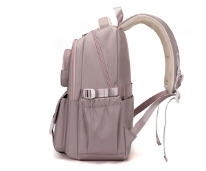 Side view of lotus pink school backpack with side buckles and ergonomic mesh straps