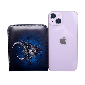 Short vintage wallet with skull print shown next to a smartphone for size reference