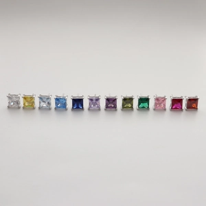 Macro display of princess cut square zirconia earrings in thirteen assorted vibrant colors