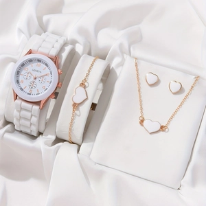 Detail of rose gold watch set with heart jewelry on elegant white silk background