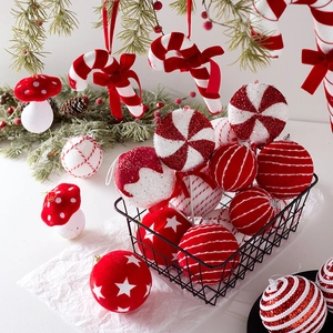 Red and white Christmas tree ornaments set with candy canes and velvet balls in a basket