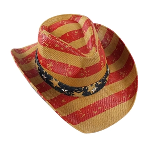 Close-up of woven straw cowboy hat featuring metal star rivets and colorful striped patterns