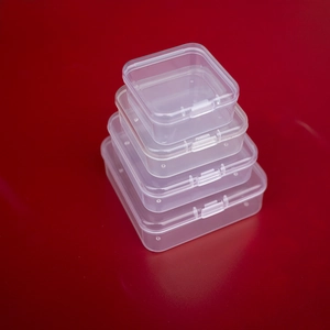 Stack of four transparent square PP plastic storage boxes in varying sizes for small items