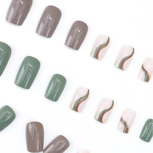 Glossy jade green and mocha press-on nails with wave patterns and golden glitter accents