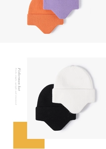 Detailed knit texture and ear-flap design of fisherman hats in multiple vibrant colors