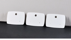 Three white jewelry display cards for earrings and brooches with hanging holes
