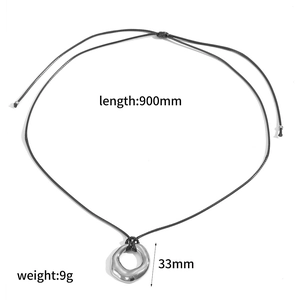 Detail view of long wax cord necklace with dimensions 900mm length and 33mm pendant