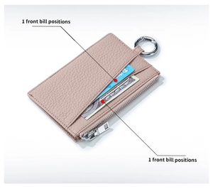 Detail of pink lychee grain leather wallet with card slots and metal ring clasp
