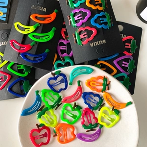 Luminous fruit hair clips for kids in vibrant colors like banana and strawberry styles
