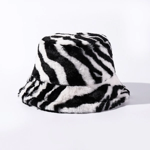 Close-up of zebra pattern plush fabric texture on a warm winter bucket hat for women