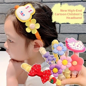Detailed view of children's cartoon hairbands featuring plush bunny and floral designs