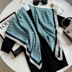 Blue silk-like square scarf with chain print, camellia brooch and elegant patterns