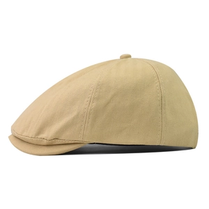 Side view of a khaki herringbone newsboy cap featuring a classic breathable design
