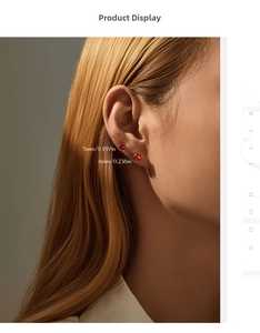 Close-up of 5mm and 6mm red round cut gemstone earrings on model with metal prongs