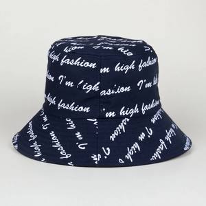 Detailed view of the dark blue bucket hat featuring all-over white script letter patterns