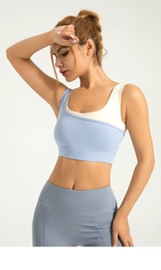 Detail of color-block high-impact sports bra with asymmetric U-neck and wide support band
