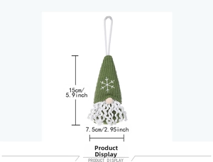 Close-up of green knitted Christmas gnome ornament with snowflake pattern and white beard